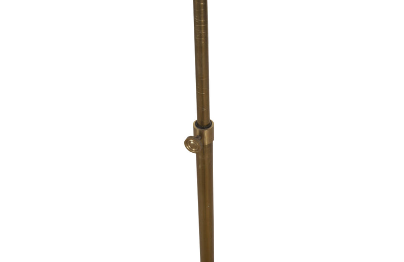 telescopic brass reading floor lamp in the Art Deco style with adjustable concertina arm.