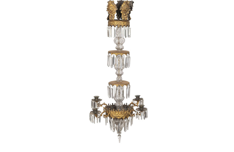 French Antique Chandelier with four tiers in gilt brass and crystal srops