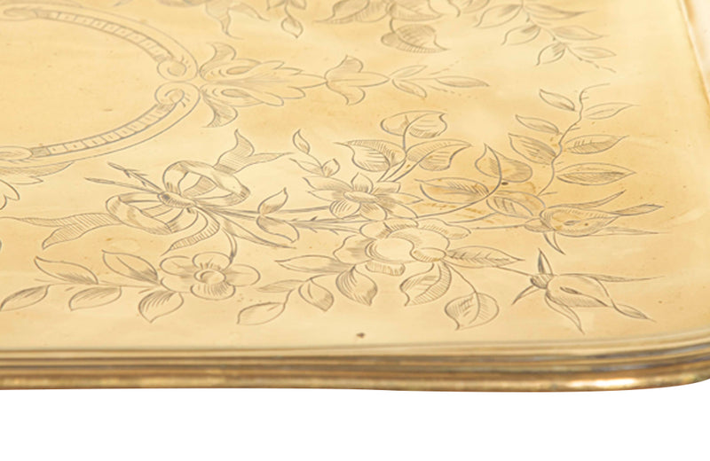 Large 19th century French brass serving tray with two handles embellished with a foliate flourish