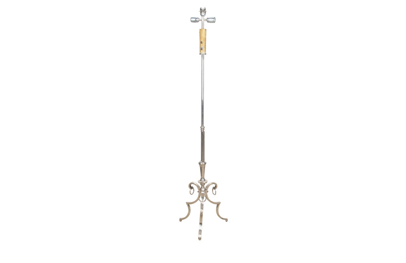 Very stylish and elegant silver plated floor lamp in the Neo-Classique style with reeded stem terminating on raised tripod base with rings.