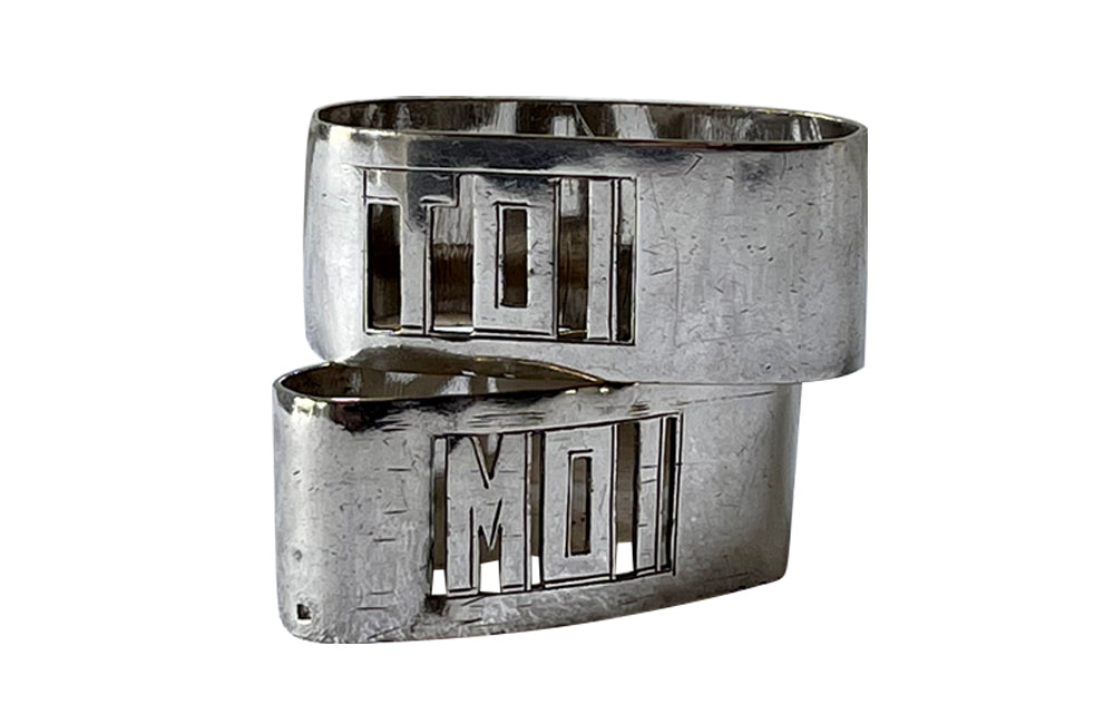 Pair of stylish Art Deco napkin rings with cut out Moi & Toi decoration [Me & You]. Circa 1930.
