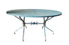 Large French mid century oval pierced iron garden table and it's matching four chairs.