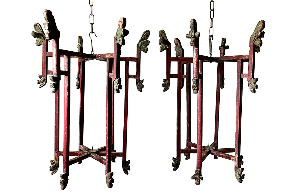 Wonderful pair of Chinese, folding wooden hanging lanterns. Dating to the early 20th century, these lovely hanging candle lights have fabulous patination and are full of atmosphere in their untouched and worn condition. Circa 1920.