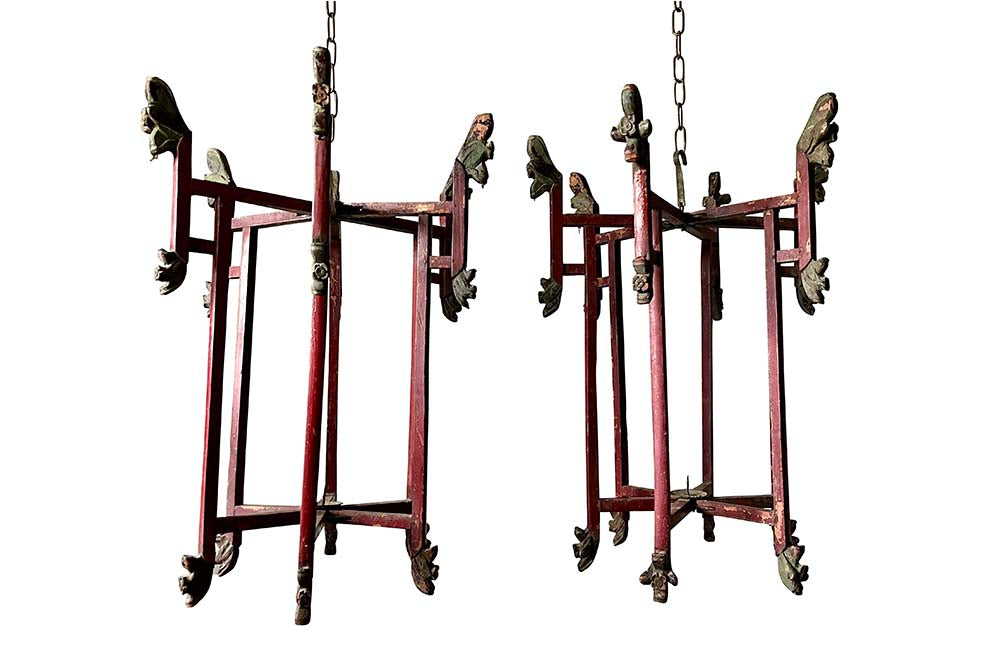 Wonderful pair of Chinese, folding wooden hanging lanterns. Dating to the early 20th century, these lovely hanging candle lights have fabulous patination and are full of atmosphere in their untouched and worn condition. Circa 1920.