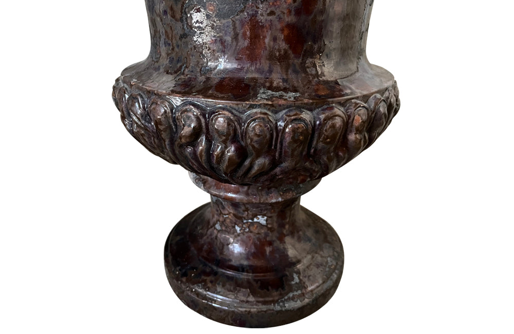 pair of beautiful French Medici terracotta urns in a faux marble glazed finish. 