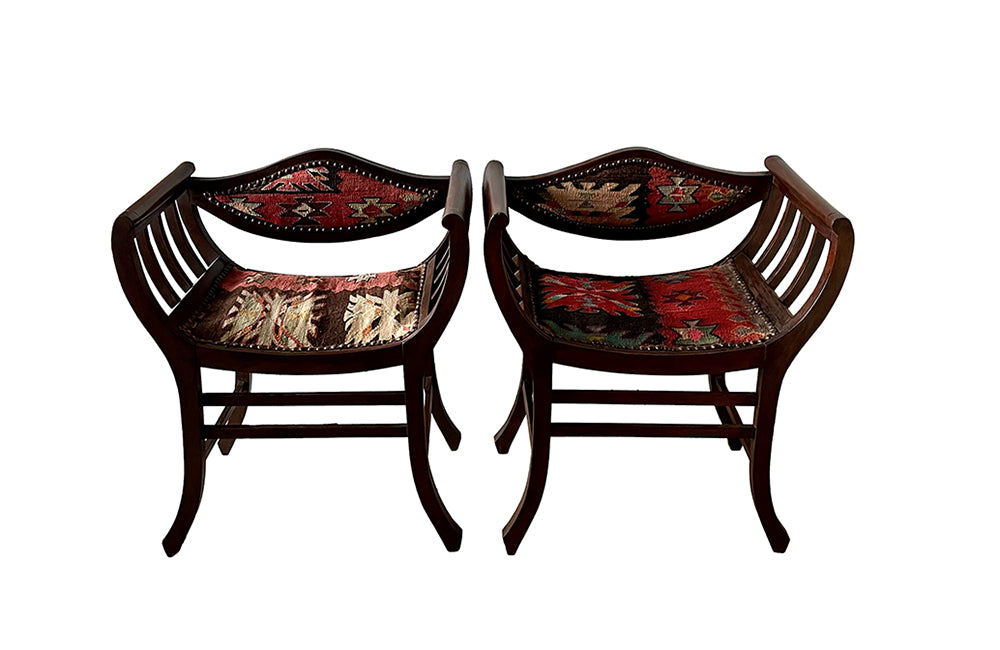 Stylish pair of early 20th century French armchairs studded and upholstered in Kilim. Circa 1920 in the Arts & Crafts Style. AD & PS Antiques