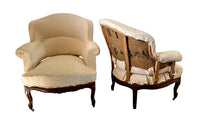 Elegant pair of walnut French armchairs in the Louis XV style.