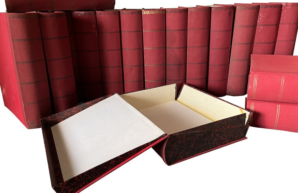 Collection of 19 Spanish faux book file boxes with fabric binding and covers.