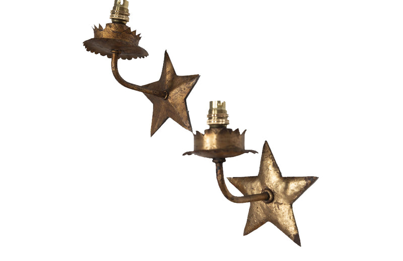  set of mid century gilt iron wall sconces in the form of stars.