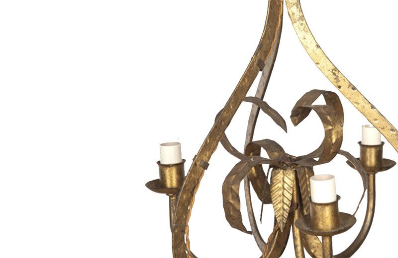 20th century Spanish gilt iron hanging light with hammered finish and central foliate decoration. 