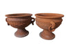 PAIR OF DECORATIVE TERRACOTTA PLANTERS