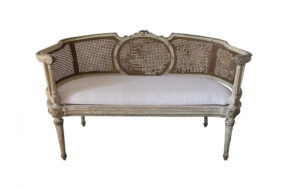 Louis XVI Revival Caned Banquette - Caned Canape - Cane and Linen Sofa - Neoclassical Revival -French Antiques - Antique Seating - Painted Antique Seating – Decorative Antique Furniture – French Antique Furniture - AD & PS Antiques
